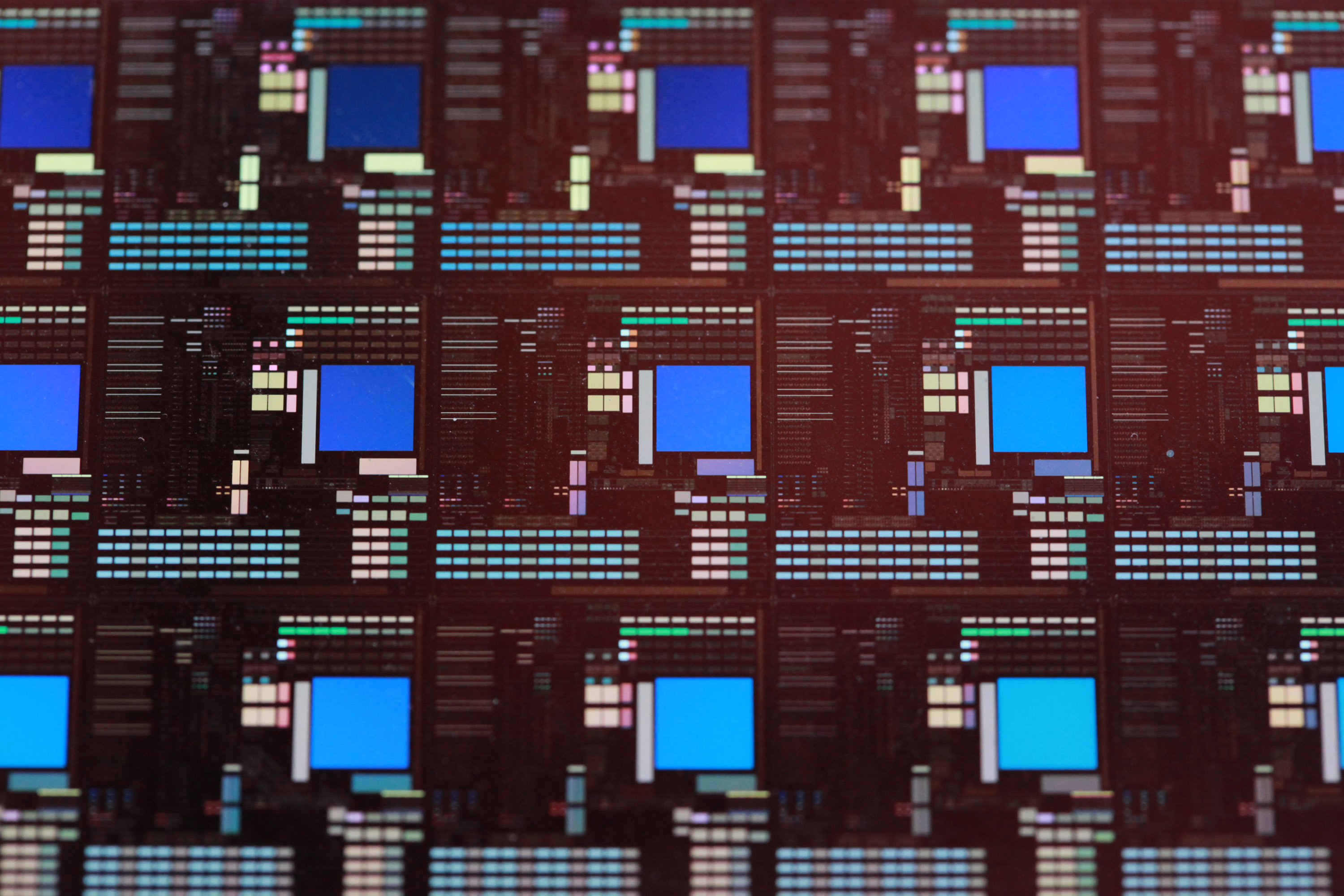 Finished chips laid out across a six-inch semiconductor wafer before being cut apart and packaged