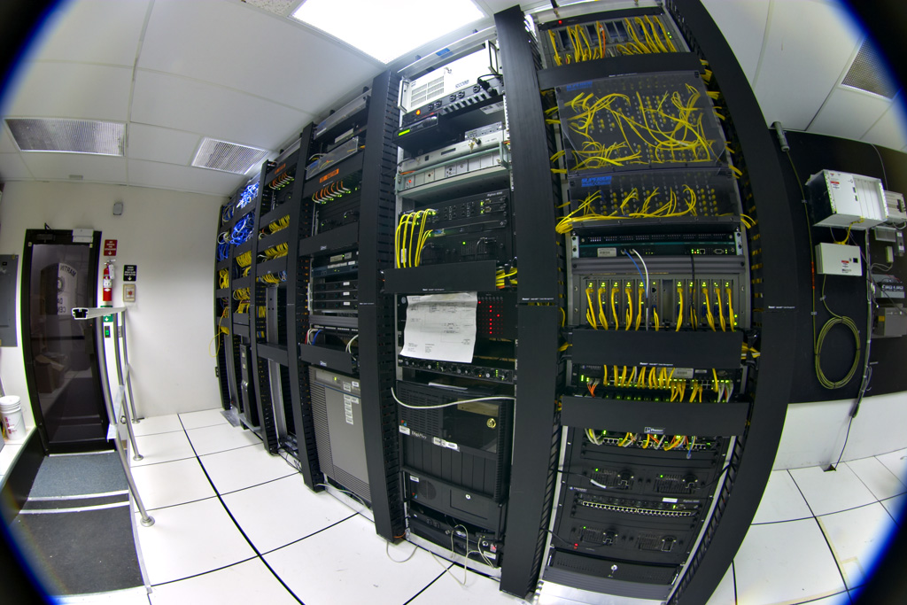 Racks of servers in a data center — GPT-5.6 Sol is being offered on Cerebras hardware at up to 750 tokens per second