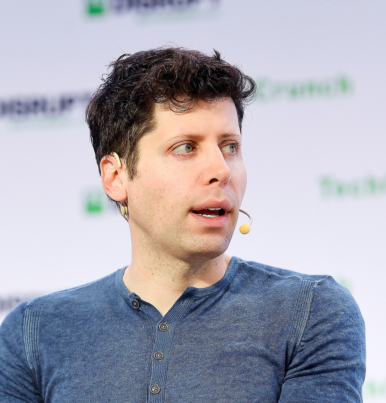 OpenAI CEO Sam Altman speaking on stage