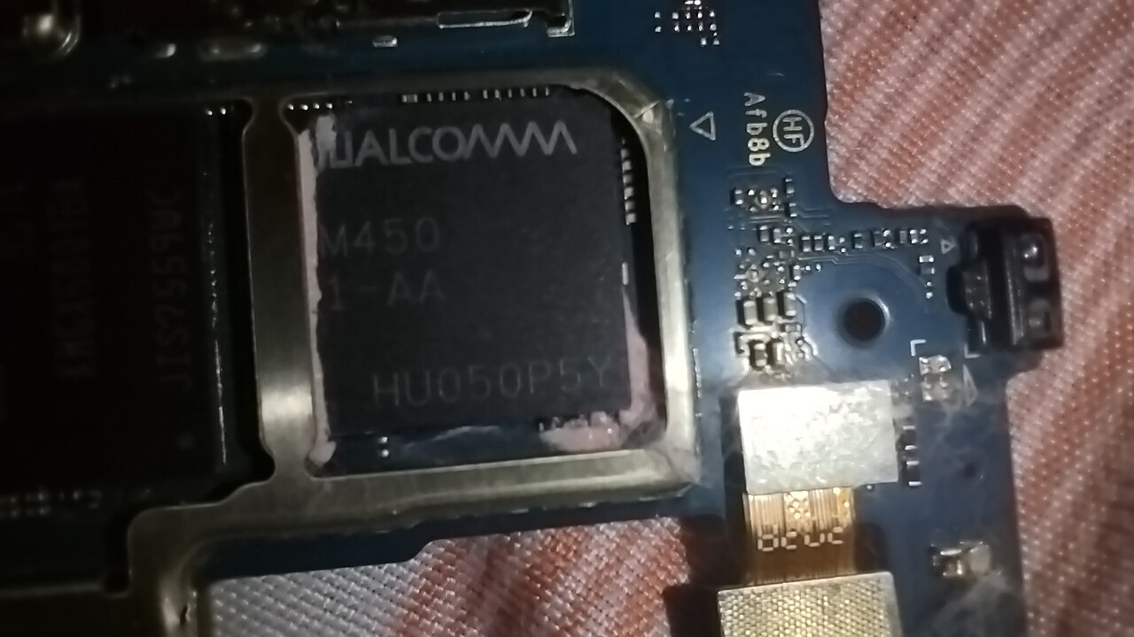 A Qualcomm Snapdragon system-on-chip — the company brings efficient silicon but has lacked the data-center software ecosystem that Modular provides